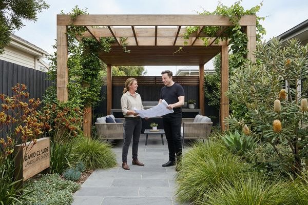 Contemporary backyard transformation with bluestone paving